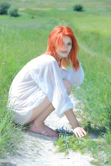 Pale redhead Violla A spreads legs to bare hot shaved teen pussy outdoors 49693593