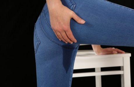 Blonde teen in tight jeans pisses herself and licks up the mess 55384231