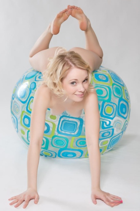 Adorable teen Feeona poses completely naked atop a medicine ball 77242657