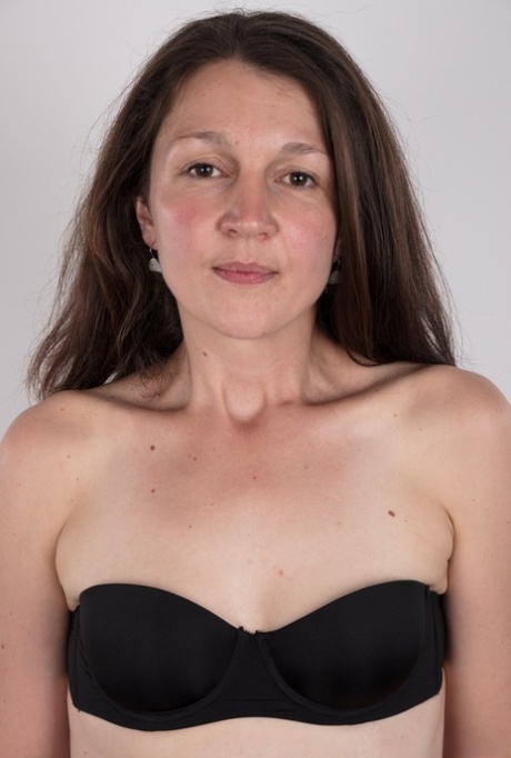 First timer Petra holds her face firm as she takes off her clothes 21103758