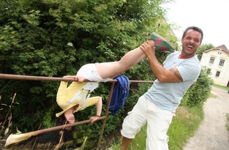 Smiley brunette gets banged outdoors after kneeling to give older guy blowjob 60670688