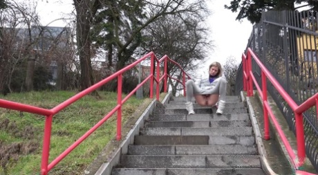 Caucasian girl Claudia Macc takes a piss on a flight of concrete steps 89435876