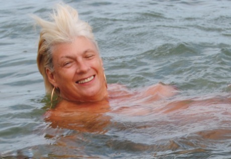 Mature granny Dimonty skinny dipping at the beach with big saggy tits hanging 14352286