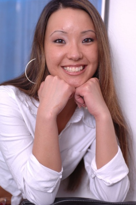 Asian first timer Miko finger spreads her cunt in front of a bookcase 84259820