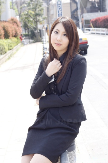 Japanese model Hikaru Matsu takes her glasses on and off in business clothing 94186843