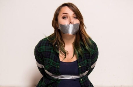 Two girls are tied up and silenced with generous amounts of duct tape 20767774