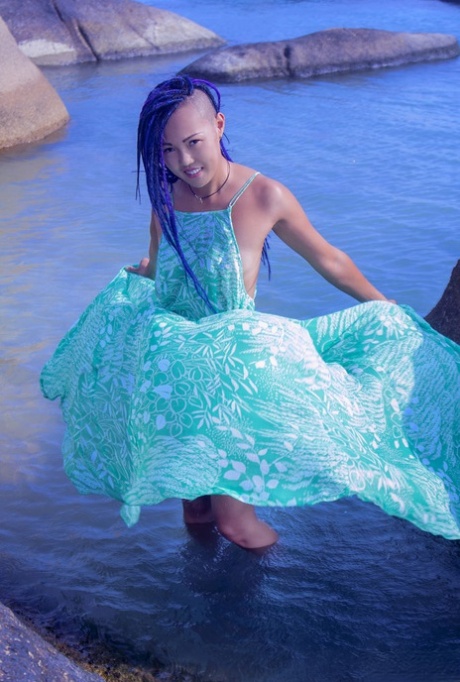 Hot Asian teen Sweet Julie removes wet dress for nude poses in water 88775439