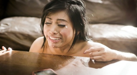 Asian hottie Ember Snow receives a facial cumshot after sex on a couch 96653793