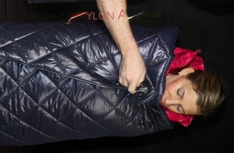 White girl is encased in a down cover and nylon jacket before being bound up 45372743