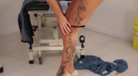 Pretty brunette strips to her birthday suit inside a medical clinic 48424065