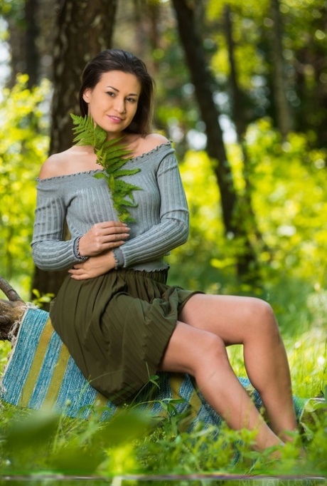 Brunette teen Lilian A gets completely naked while in a forest 67438675