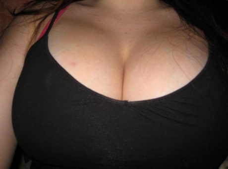 Amateur girl unveils her great tits while taking self shots 30330758