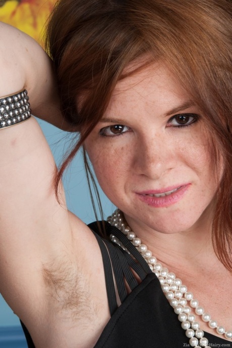 Slutty redhead Zia reveals her hairy body while posing at home 28362376
