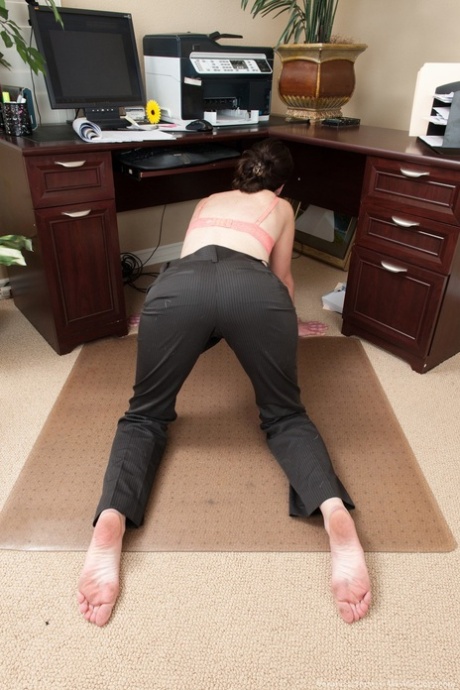 Businesswoman Veronica Snow shows off her hairy bush in her home office 54121209