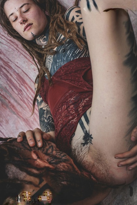 Heavily tattooed couple engage in oral sex while in a skate pool 49708387