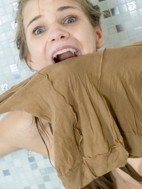 Cute girl Sarah Kay gets entangled in layers of hose while in a bathtub 93908521