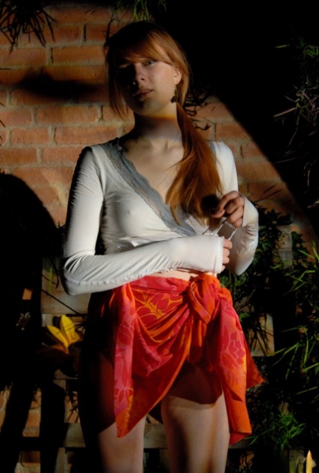 Natural redhead Lina exposes her underwear during upskirt action in a garden 51777611
