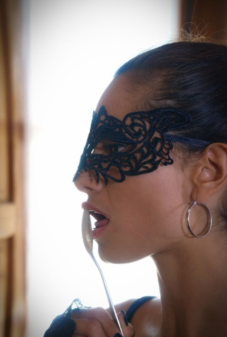 Hot female Solange sports a mask while inserting fine cutlery into her pussy 10674977