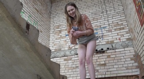 Blonde chick Nastya takes off her underwear before pissing in a stairwell 77705984