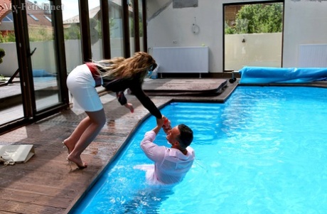 Horny couple keeps their clothes on as they fuck in and out of the pool 68750516