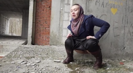 Solo girl Anya pulls down her pants for an urgent pee at an abandoned building 61665311