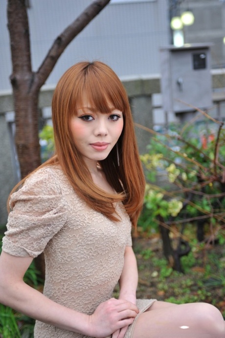 Hot Japanese girl with red hair Reika Kitahara poses outdoors in a short dress 44281695