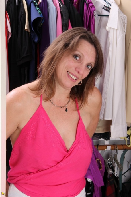 American housewife models naked while trying on lingerie in walk in closet 34449808