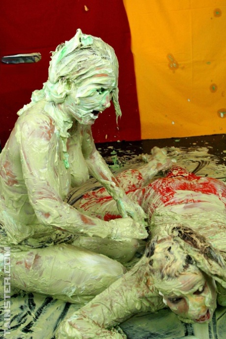 Clothed women get covered in slime while wrestling each other to the ground 76436676