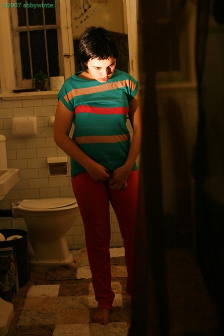 Hidden camera films short haired girl getting dressed after taking bath 91632510