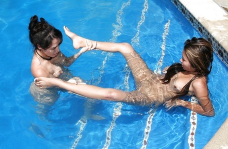 Lewd asian MILF and her latina friend have some pussy licking pool fun 87094921